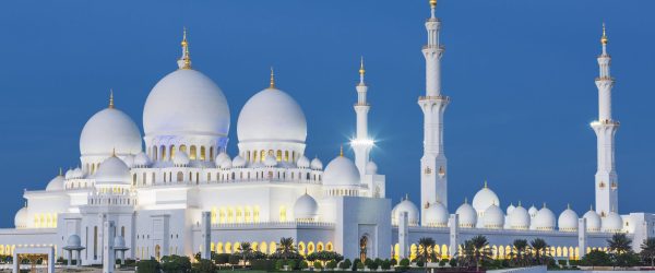 View of famous Abu Dhabi Sheikh Zayed Mosque by night, UAE.